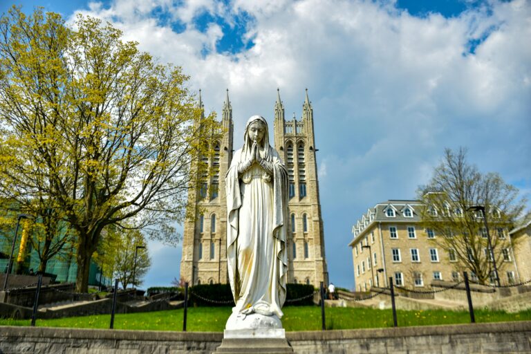 Gothic architecture of St. Mary's Church with a Virgin Mary statue in Guelph, Canada.