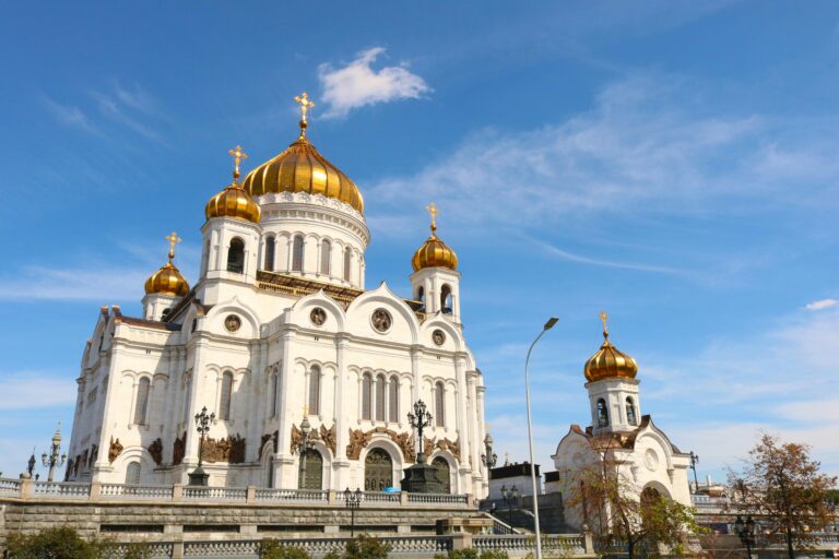 Stunning view of the Christ the Saviour Cathedral with golden domes under a clear blue sky in Moscow, Russia.