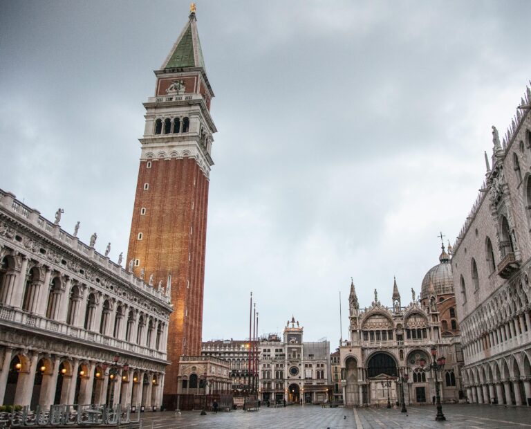 A serene view of St. Mark's Square in Venice featuring the iconic Campanile and Basilica.