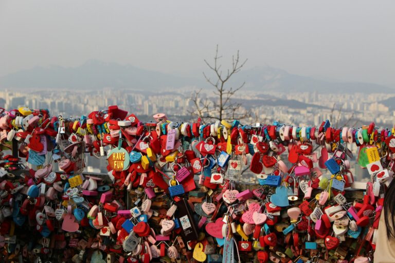 Vibrant love locks against Seoul skyline at Namsan Tower, a popular romantic landmark.