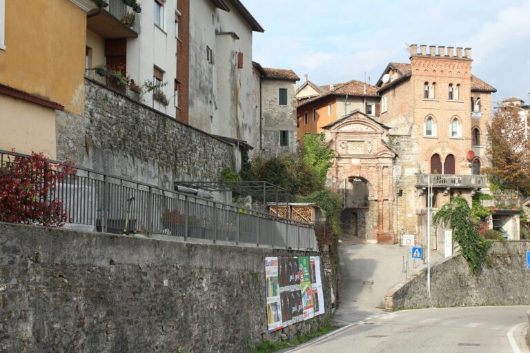 Charming blend of historic architecture on a narrow street in Belluno, Veneto, Italy.