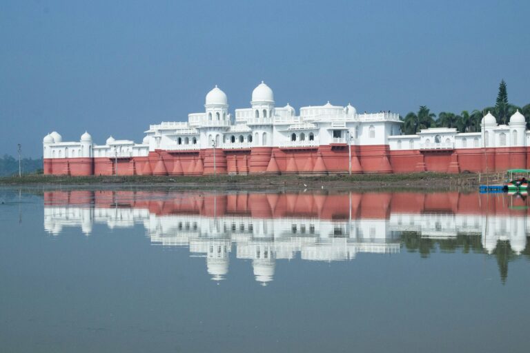 Stunning view of Neermahal Palace reflected in the serene waters of the lake in Agartala, India.